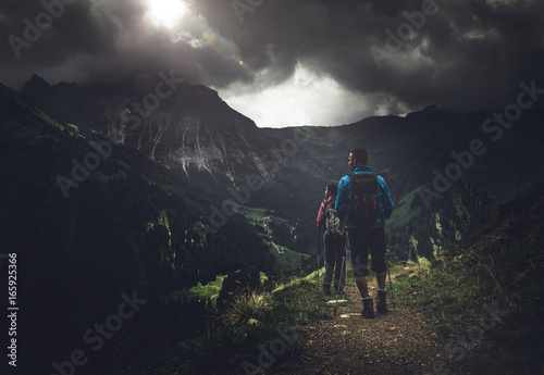 Man and woman hiking in mountains