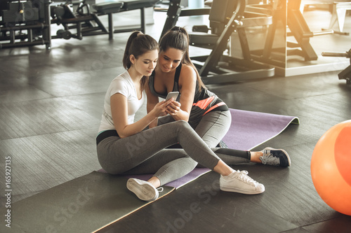 Young women exercise together in the gym