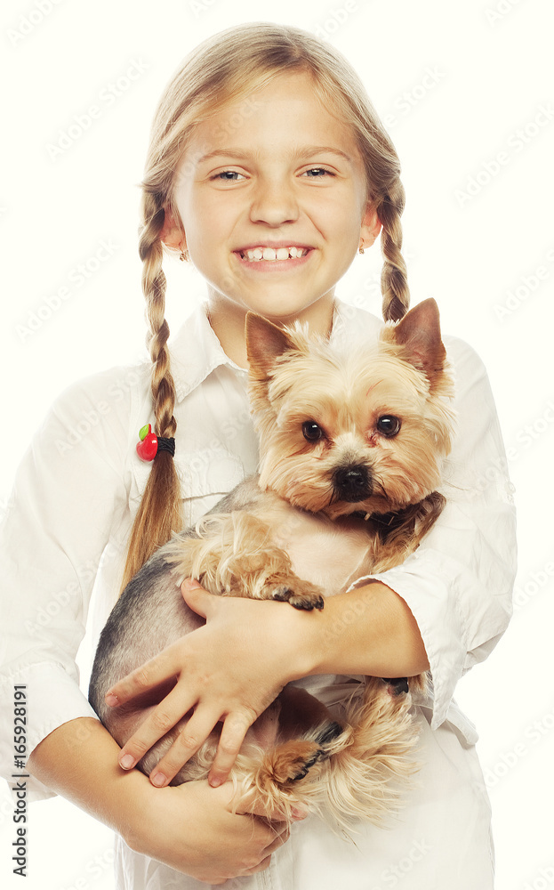 Portrait of an adorable young girl smiling holding a cute puppy Portrait of an adorable young girl smiling holding a cute puppy