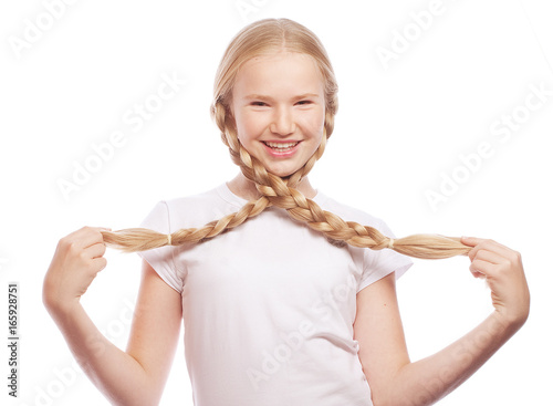 Portrait of a beautiful European blonde girl with braids.