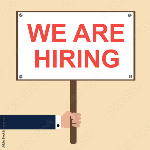 Hiring concept. Hand holding signboard with We are hiring text on it. Flat vector illustration
