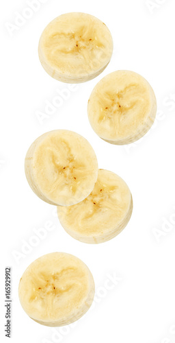 Isolated flying banana. Peeled falling banana slices isolated on white, with clipping path