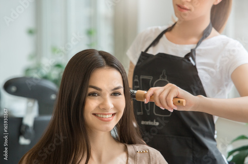  Young women sitting in beauty hair salon style