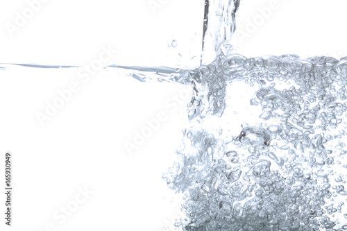 Pouring drinking water and bubble air isolated on white background with space for copy.