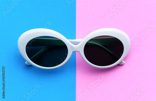 Flat lay fashion style sunglasses on colorful background