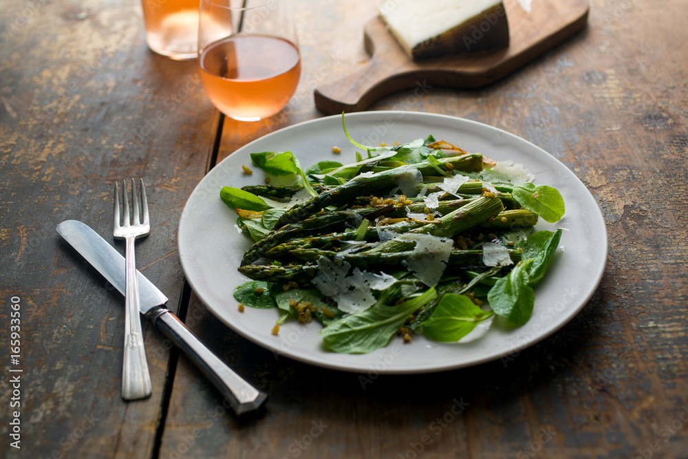Asparagus salad served with wine and cheese on the table Asparagus salad served with wine and cheese on the table