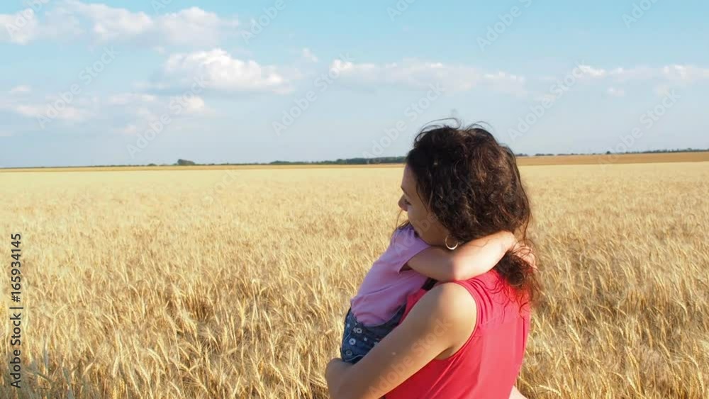 Little daughter hugs mom. A child is hugging her mother. Little daughter hugs mom. A child is hugging her mother.