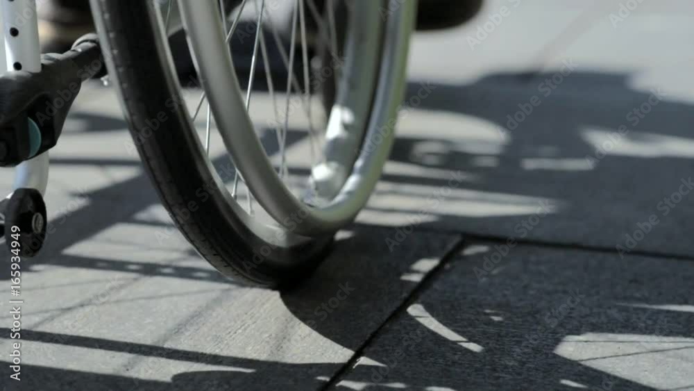 Low angle view of a differently abled man using wheelchair