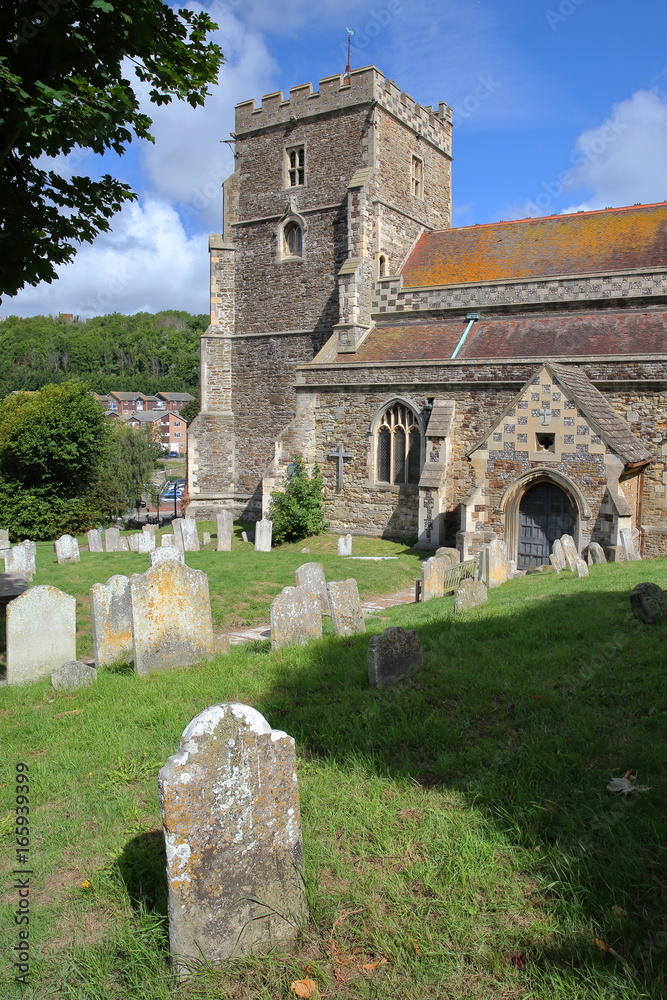 All Saints Church with tombs in the foreground in Hastings, UK