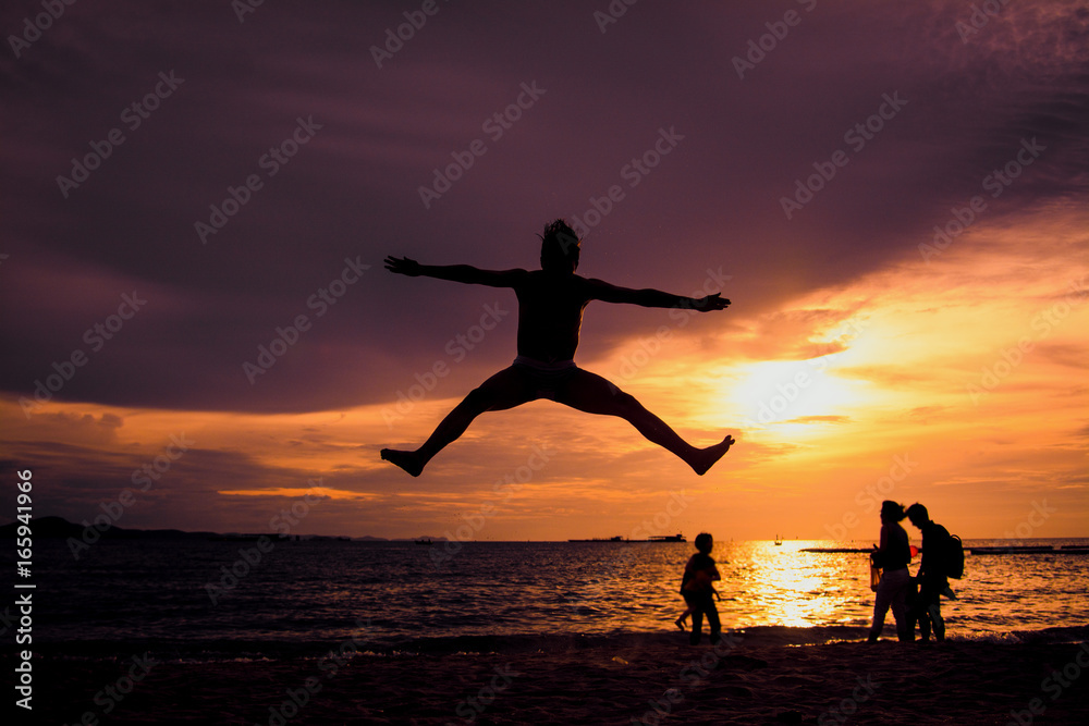 Man jumps on the beach