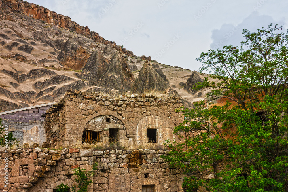 Cappadocia - ancient cave mountain monastery in Cavusin, Turkey