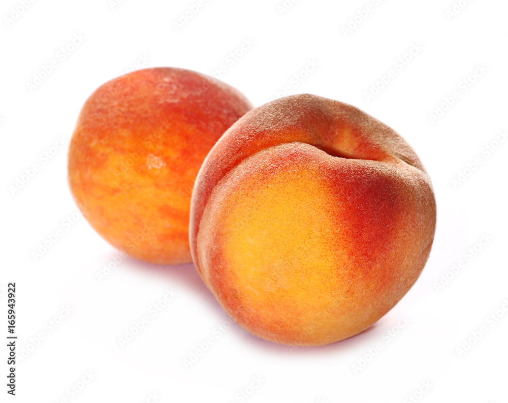 Ripe peaches isolated on white background