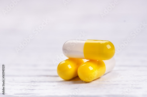 Pharmacy background on a white table. Tablets on a white background. Pills. Medicine and healthy. Close up of capsules. Differend kind of pills