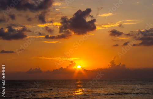 Amazing sea sunset, the sun, waves, clouds