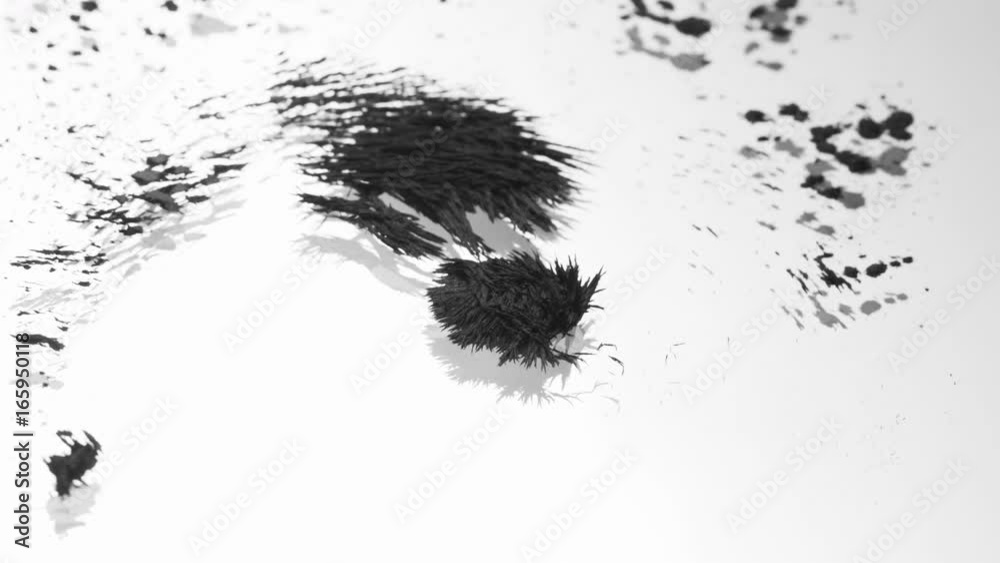 Grey magnetic sand joins together in movement, macro Grey magnetic sand joins together in movement, macro