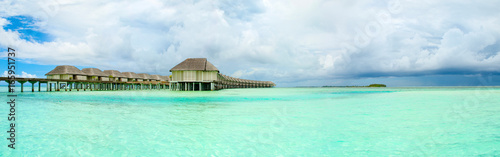 Panoramic landscape of Maldives beach with overwater bungalow © Myroslava