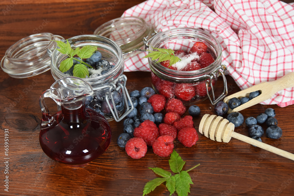 blueberries and raspberries in jars for the winter tea blueberries and raspberries in jars for the winter tea
