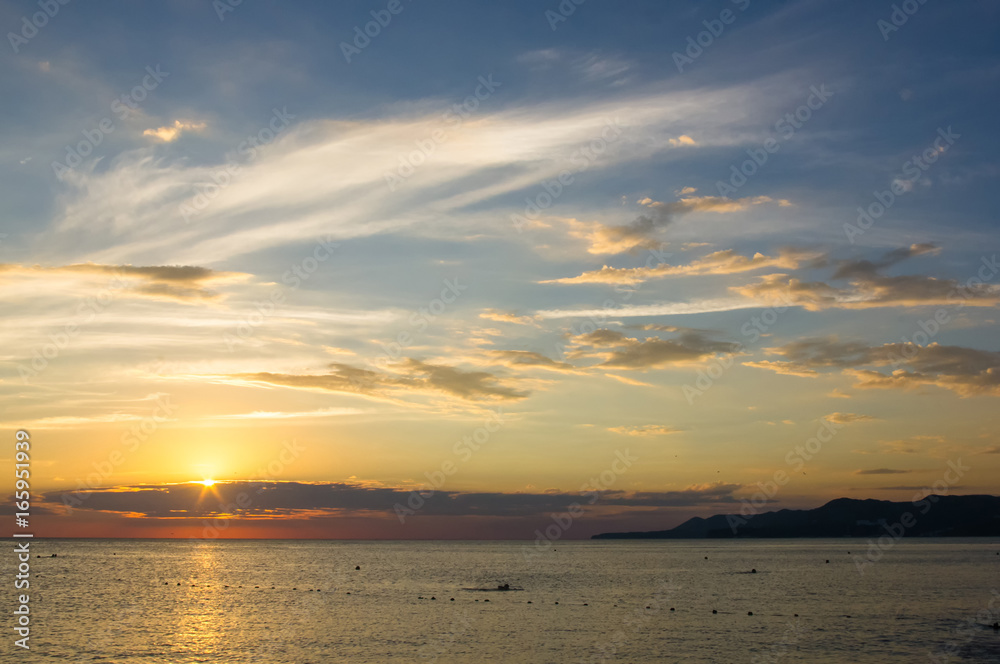 Amazing sea sunset, the sun, waves, clouds