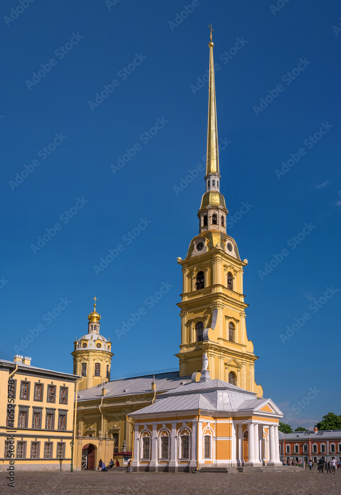 The Cathedral of Peter and Paul in the Peter and Paul fortress. It is the tallest architectural structure in St. Petersburg. In the foreground is the boat house.