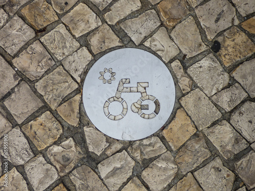 Bike path sign on portuguese pavement (calcada portuguesa) in Cacilhas, Almada