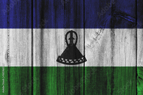 Lesotho flag painted on wooden wall for background photo