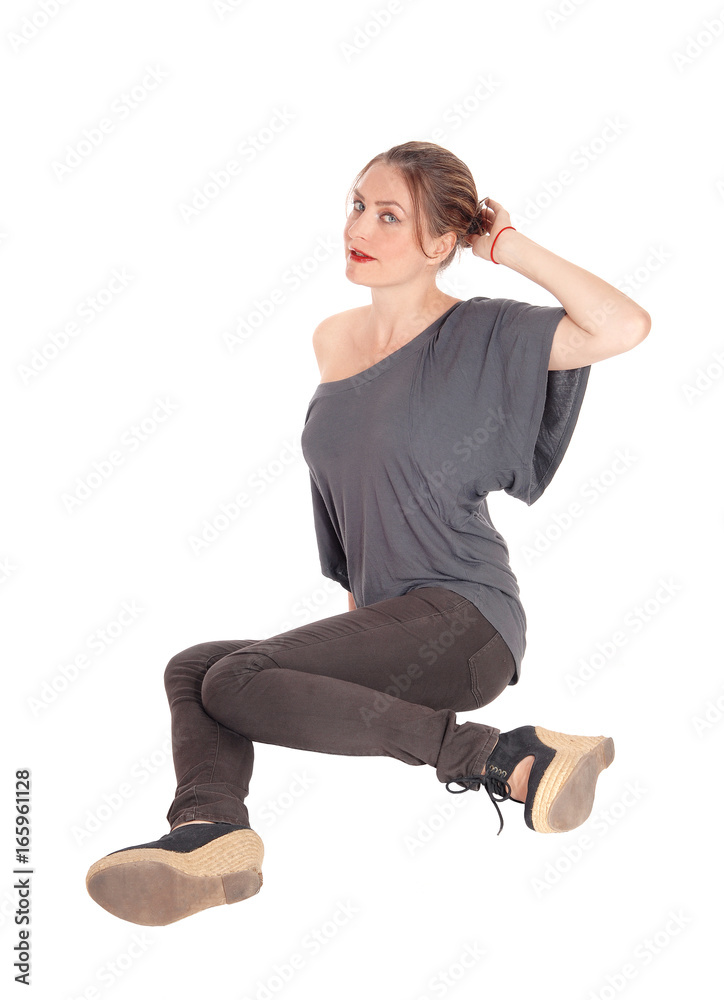Woman sitting on floor and looking up Woman sitting on floor and looking up