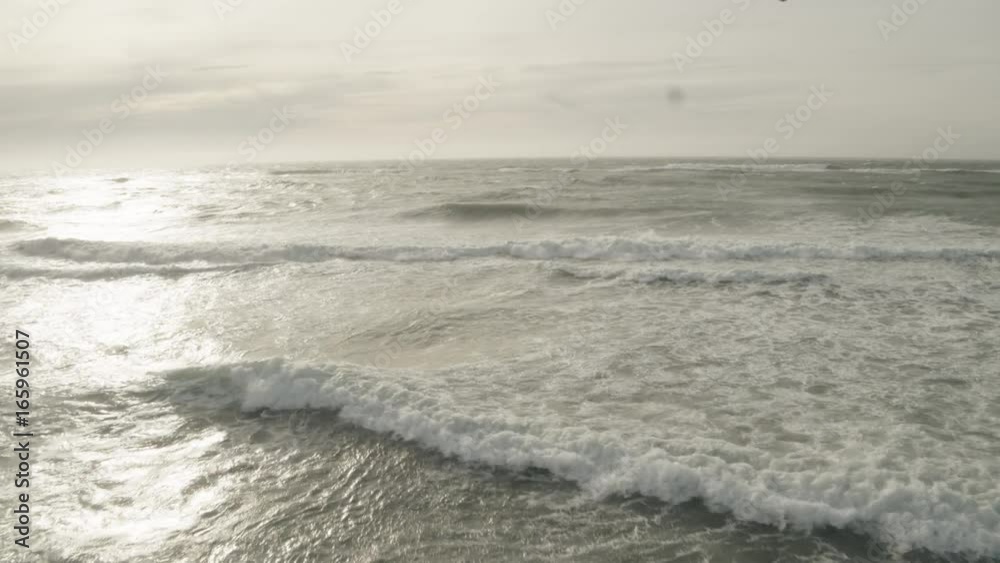 Waves crash on icy beach Waves crash on icy beach