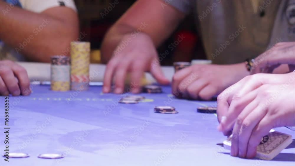 Croupier shuffling cards on poker table. Croupier shuffling cards on poker table.