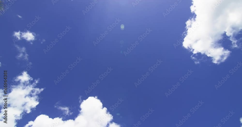 Timelapse, clouds roll in blue sky