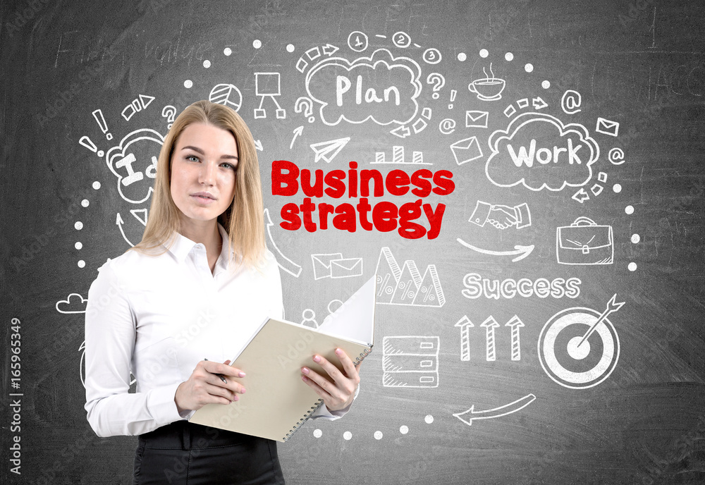 Serious businesswoman with a copybook, strategy Serious businesswoman with a copybook, strategy
