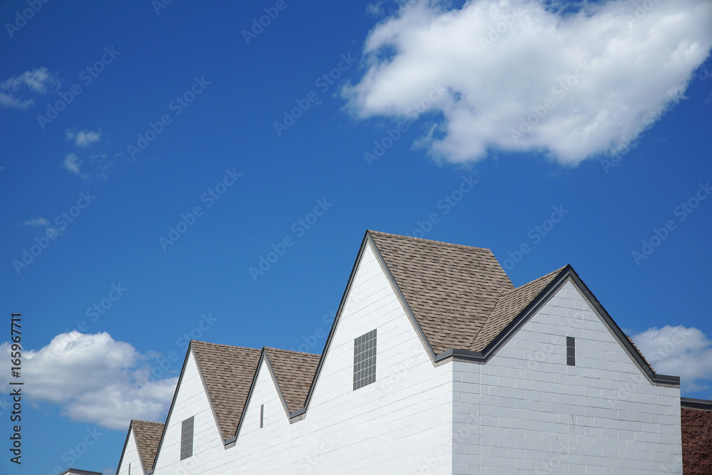 building and roof under blue sky