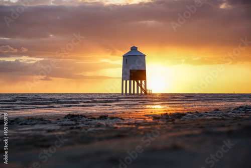 Sunset with wooden lighthouse Burnham on sea photo