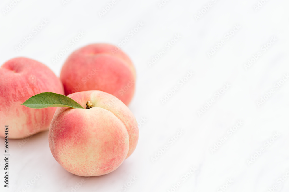 Fresh Japan White Peaches on White Background Fresh Japan White Peaches on White Background