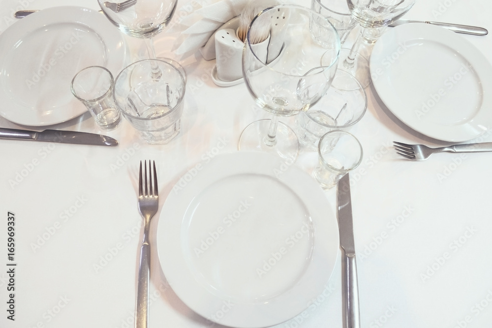 Blurred image serving a restaurant table before the event. Toned image Blurred image serving a restaurant table before the event. Toned image