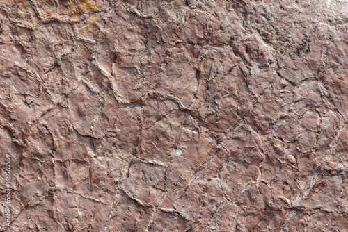 Close up of a red brown stone mountain side texture