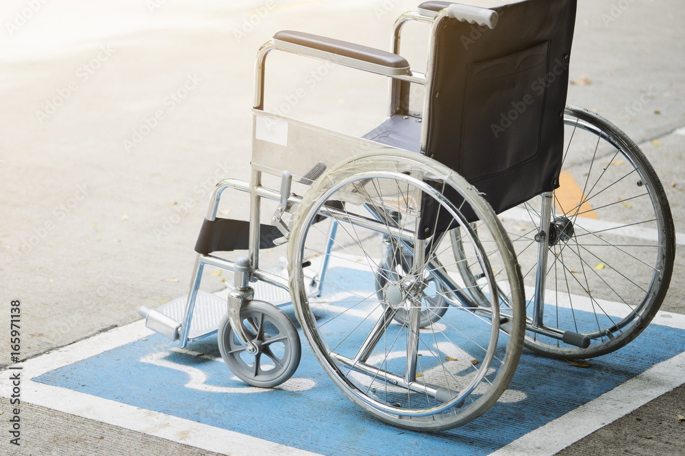 Pavement handicap symbol and wheelchair in the hospital, medicine and healthy concept