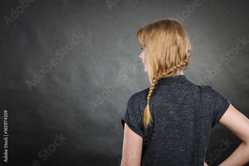 Woman with blonde hair and braid hairdo