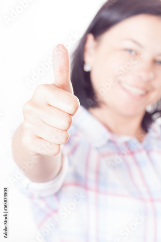 Happy Smiling Beautiful Young Woman Showing Thumb Up