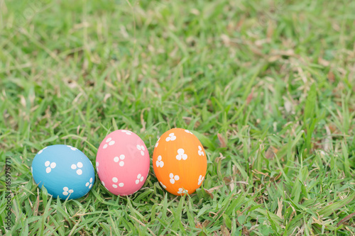 Colorful easter eggs on green grass