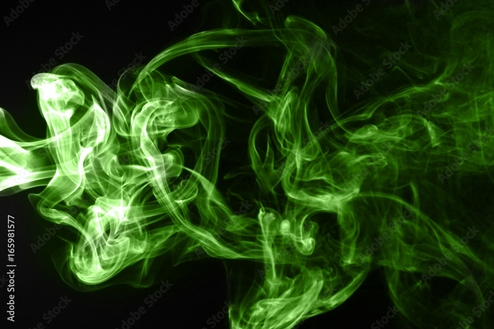 Green smoke on black background Green smoke on black background