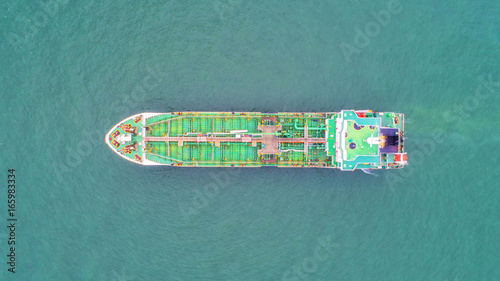 oil tanker, gas tanker in the high sea.Refinery Industry cargo ship. top view,aerial view,Thailand, in import export, LPG,oil refinery, Logistics and transportation with working crane bridge in harbor