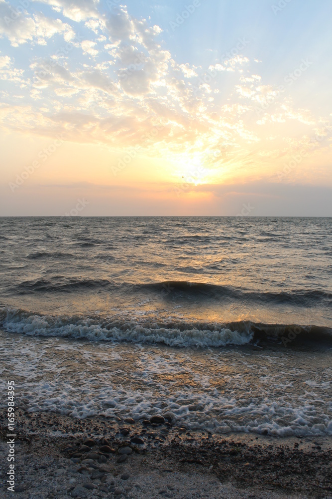 Sunset and waves at sea