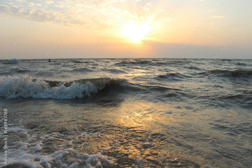 Sea and waves at sunset 