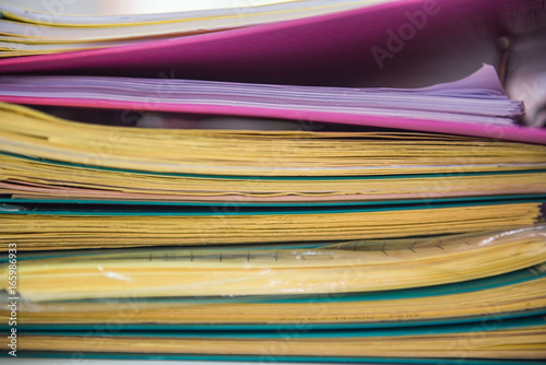 Pile of paper files  documents on work desk in office    business paper .