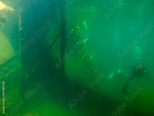 scuba diving underwater in deep quarry