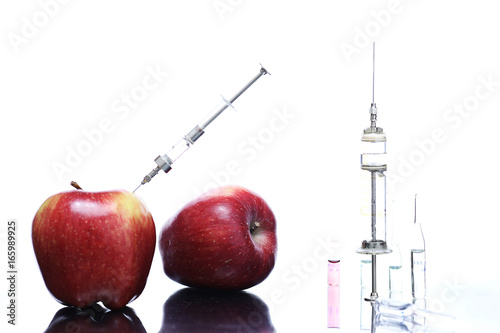 Genetically modified foods, apple pumped with chemicals