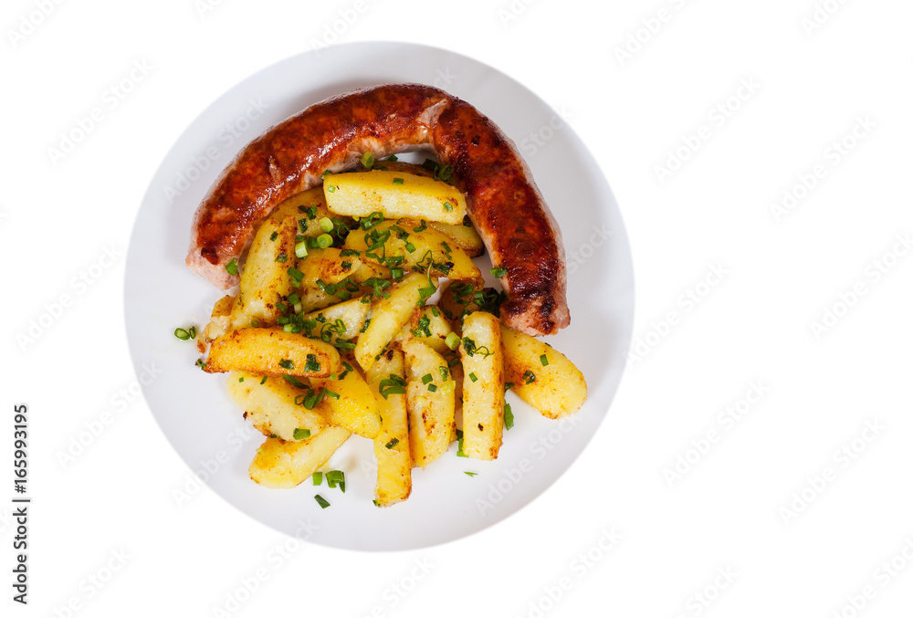 grilled meat sausages with fried potatoes in a plate. top view. isolated on white