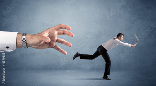 Fotografie Businessman running from hand
