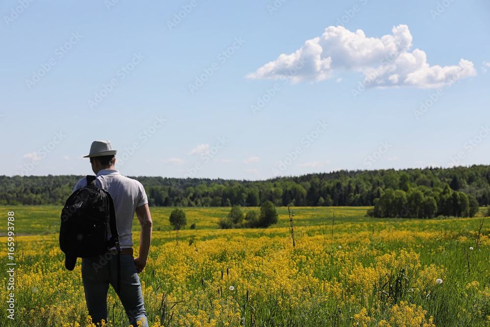 Young man travels with a backpack
