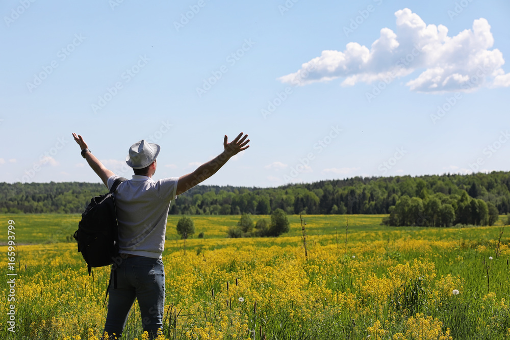 Young man travels with a backpack Young man travels with a backpack
